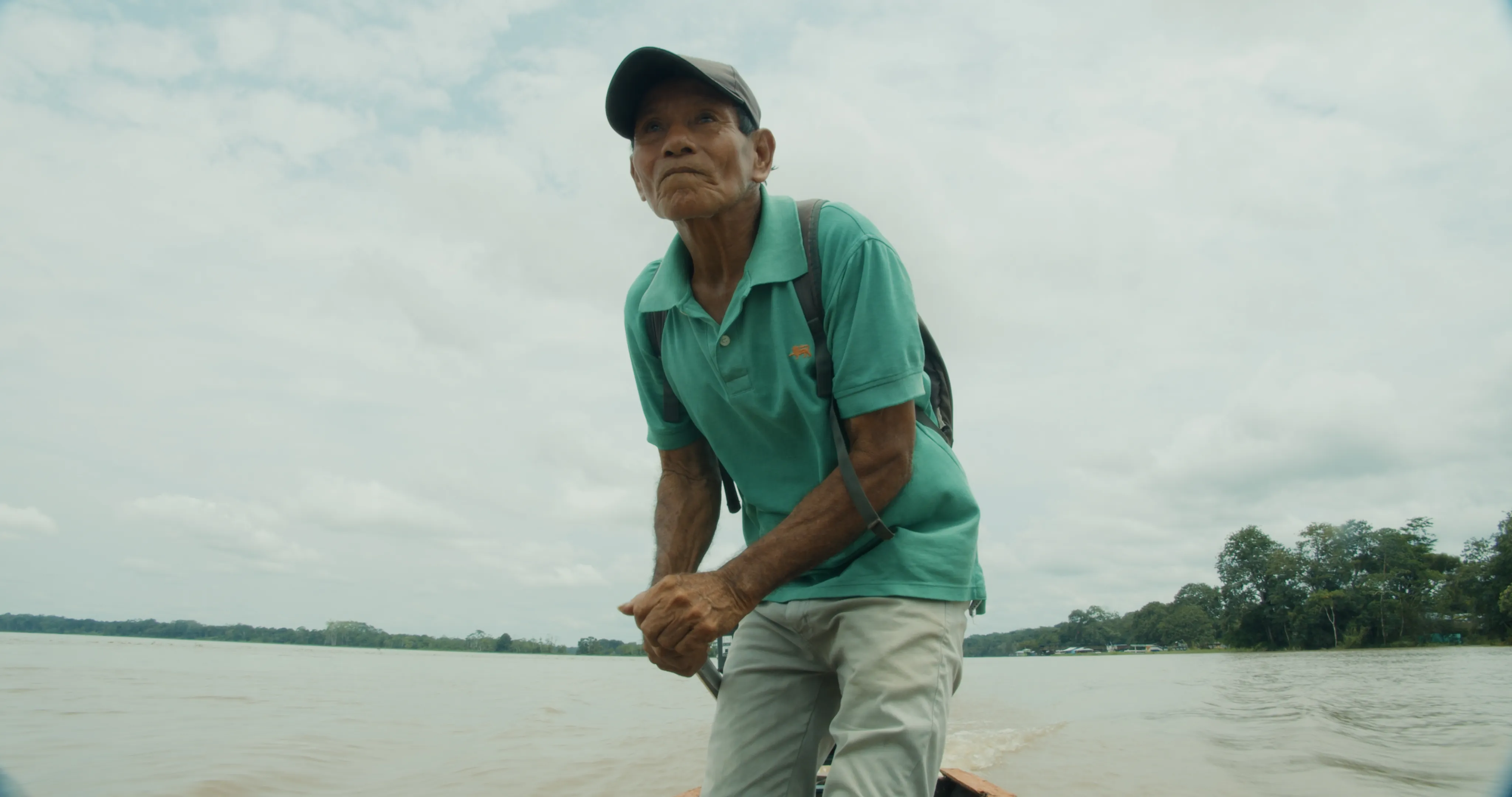 a local man fishing in the river that provides the village with everything they need