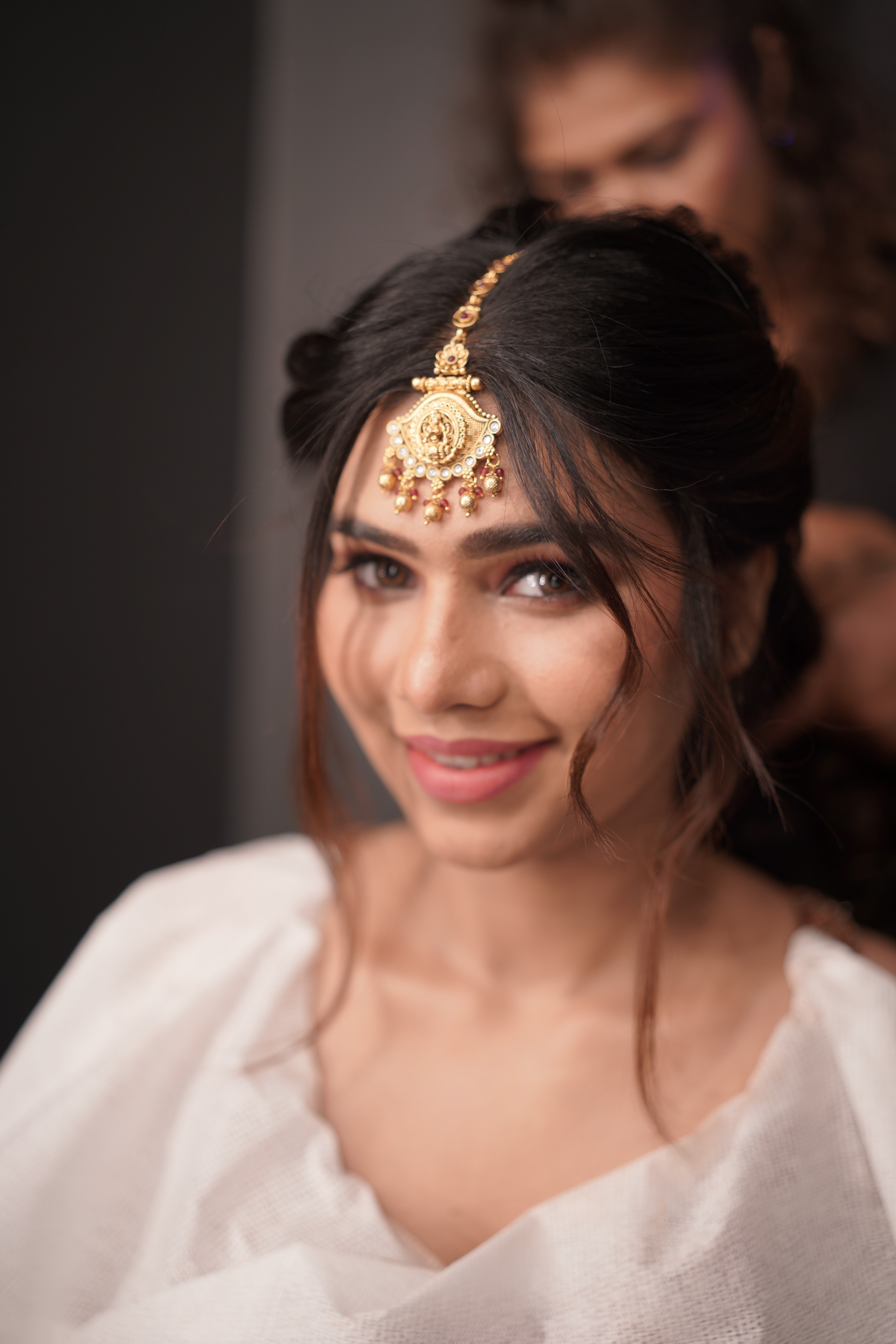 woman with pink and gold eyeshadow makeup