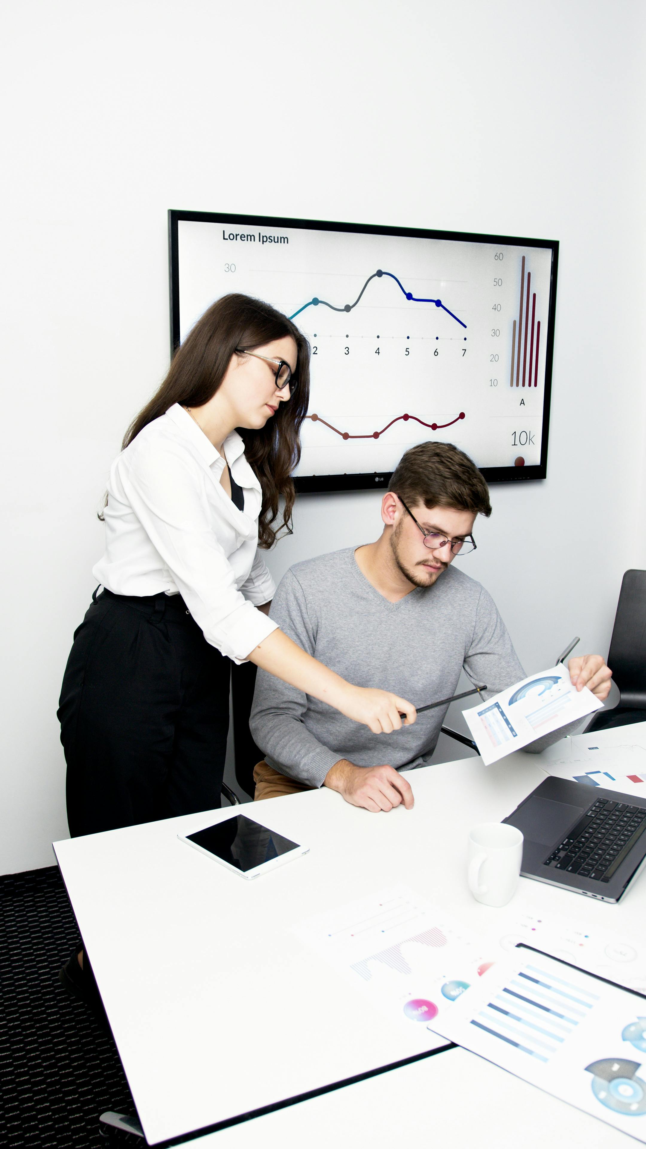 husband and wife working happily on a laptop