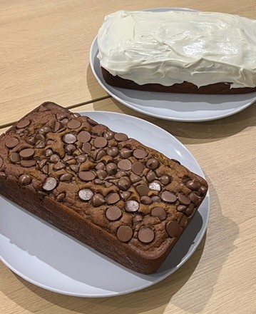 Two pumpkin loafs - one with icing and one with chocolate chips