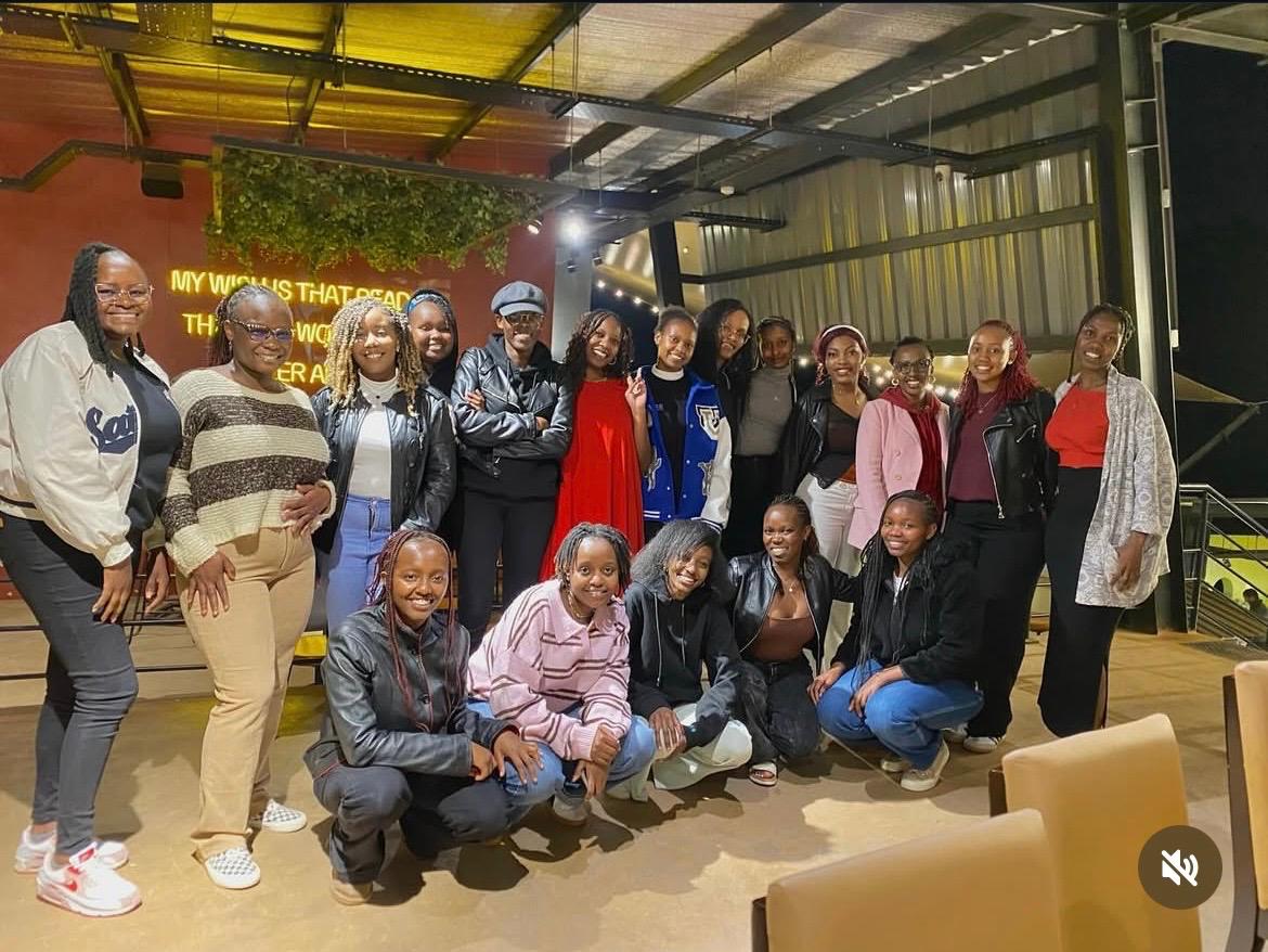 a group of people walking on a sidewalk