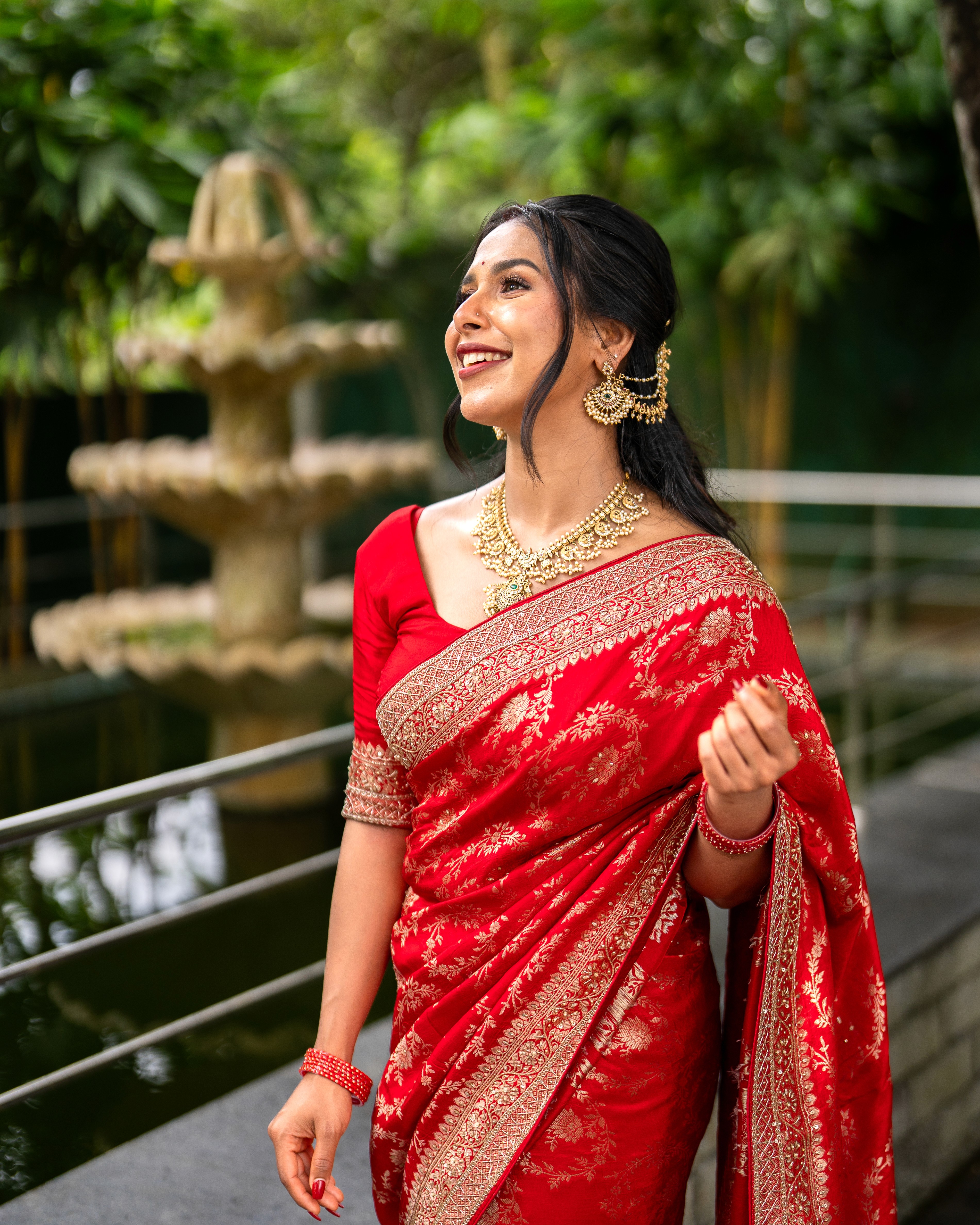 Person planting a houseplant and checking phone