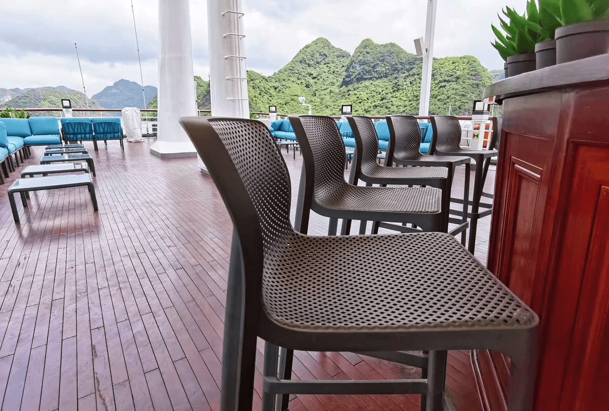 a restaurant with a large table and chairs