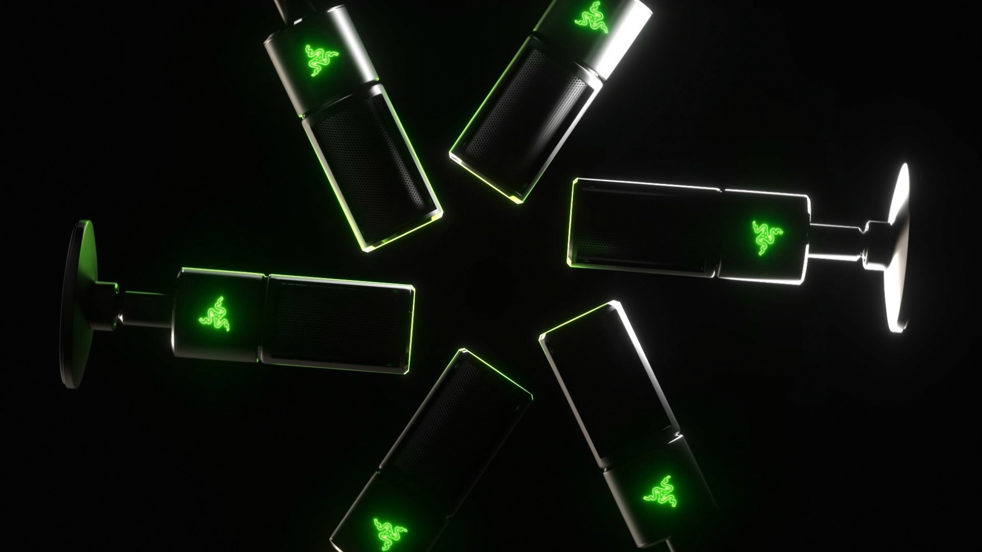 Draufsicht auf die explodierten Bauteile des Mikrofons in kreisförmiger Anordnung mit grünen Leuchteffekten und technischer Ästhetik