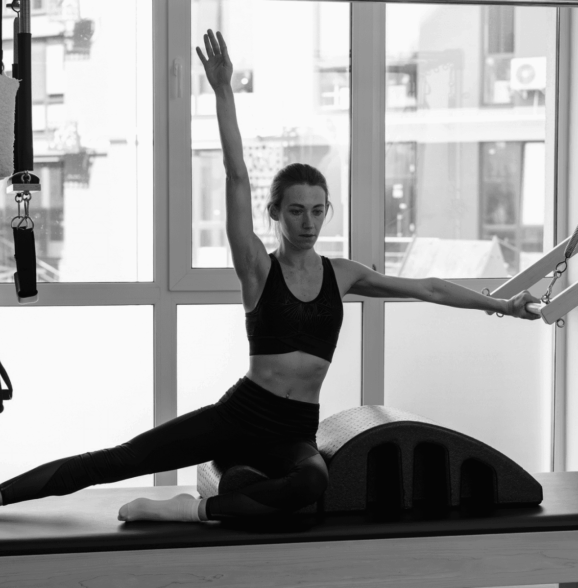 Woman improving posture and flexibility through pilates