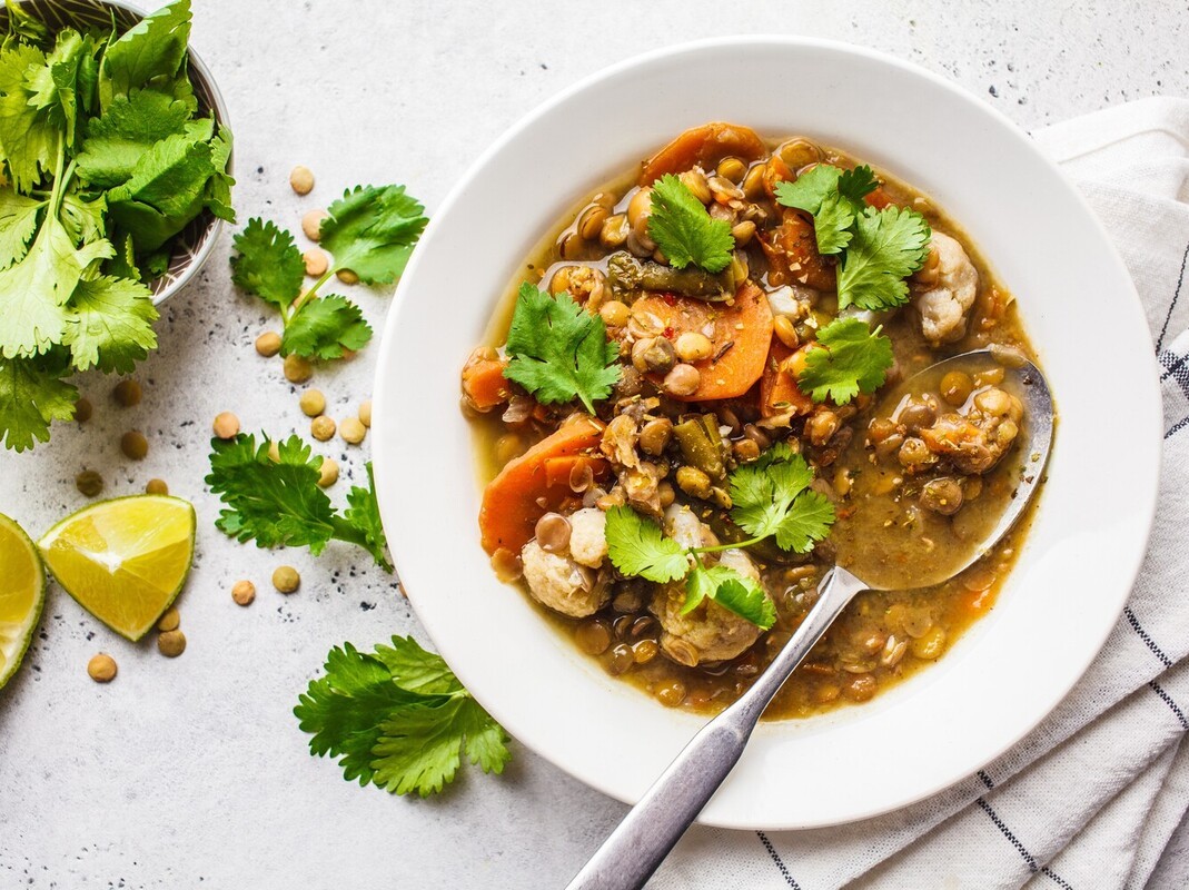 a hearty bowl of lentil soup with vegetables, showing the best way to lose weight without exercise