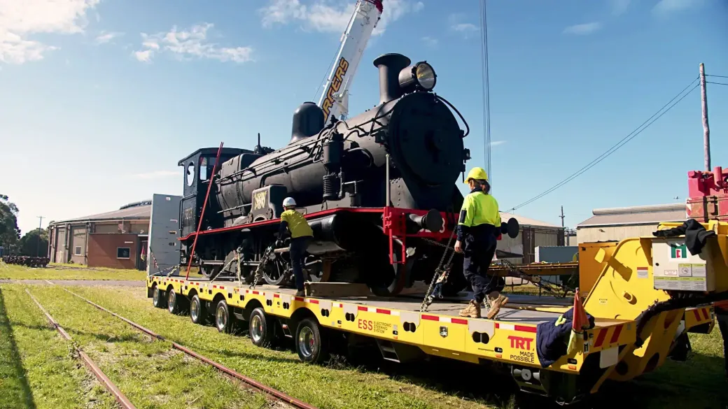 Locomotive 3203 sits on a flatbed truck.