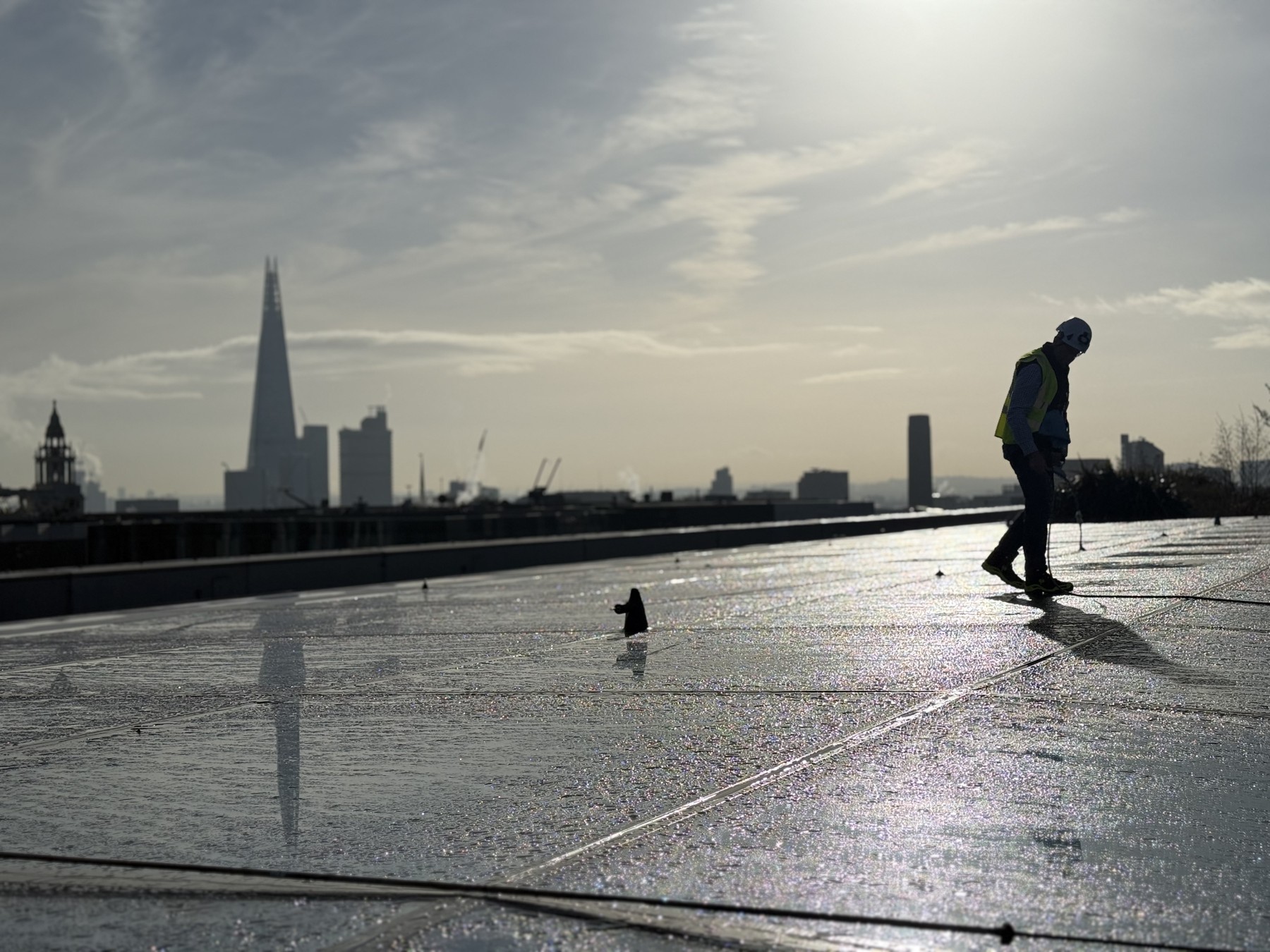 Operative on a wet rooftop during site works