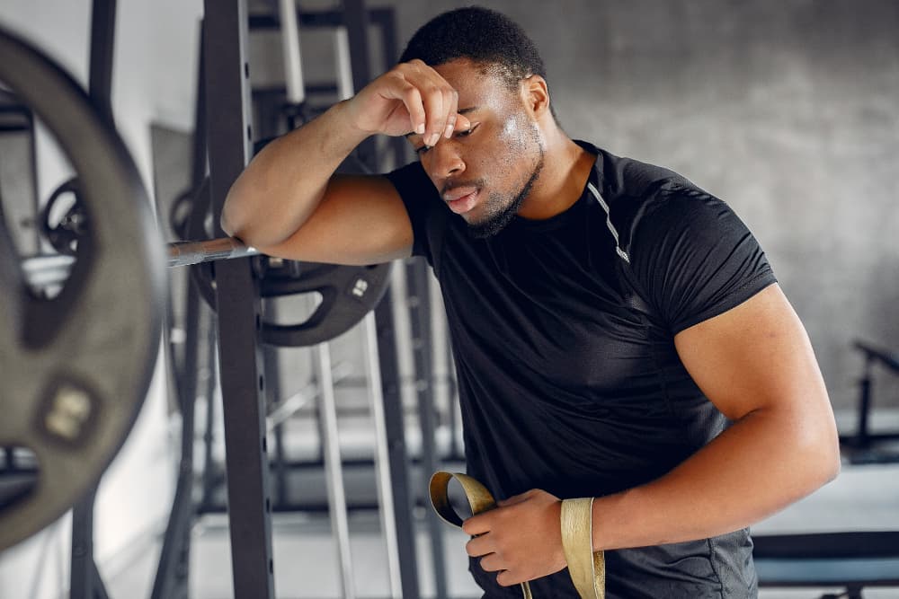 A couple of men working out in a gym