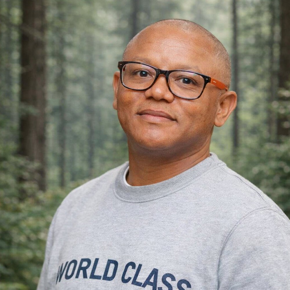 African man with glasses in the woods