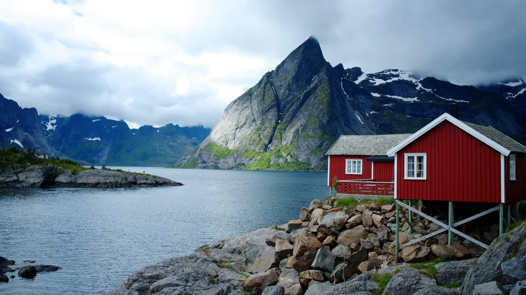 house on stilts in the mountains beside a river