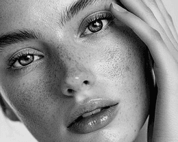 a woman sitting on a chair with her legs crossed