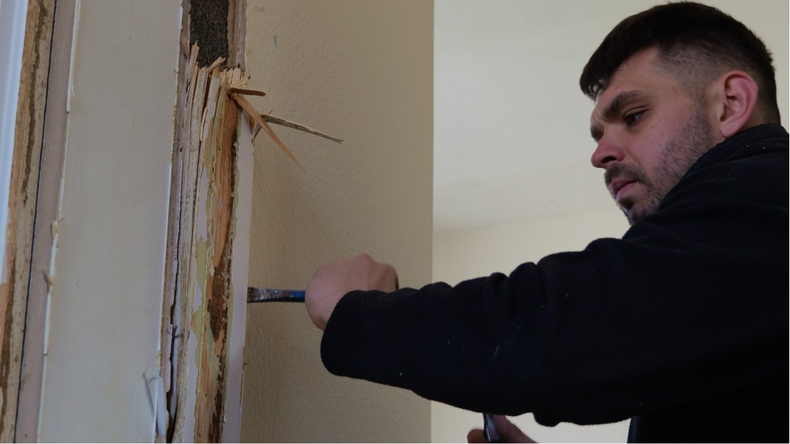 Builder carrying out internal strip out works during domestic property refurbishment