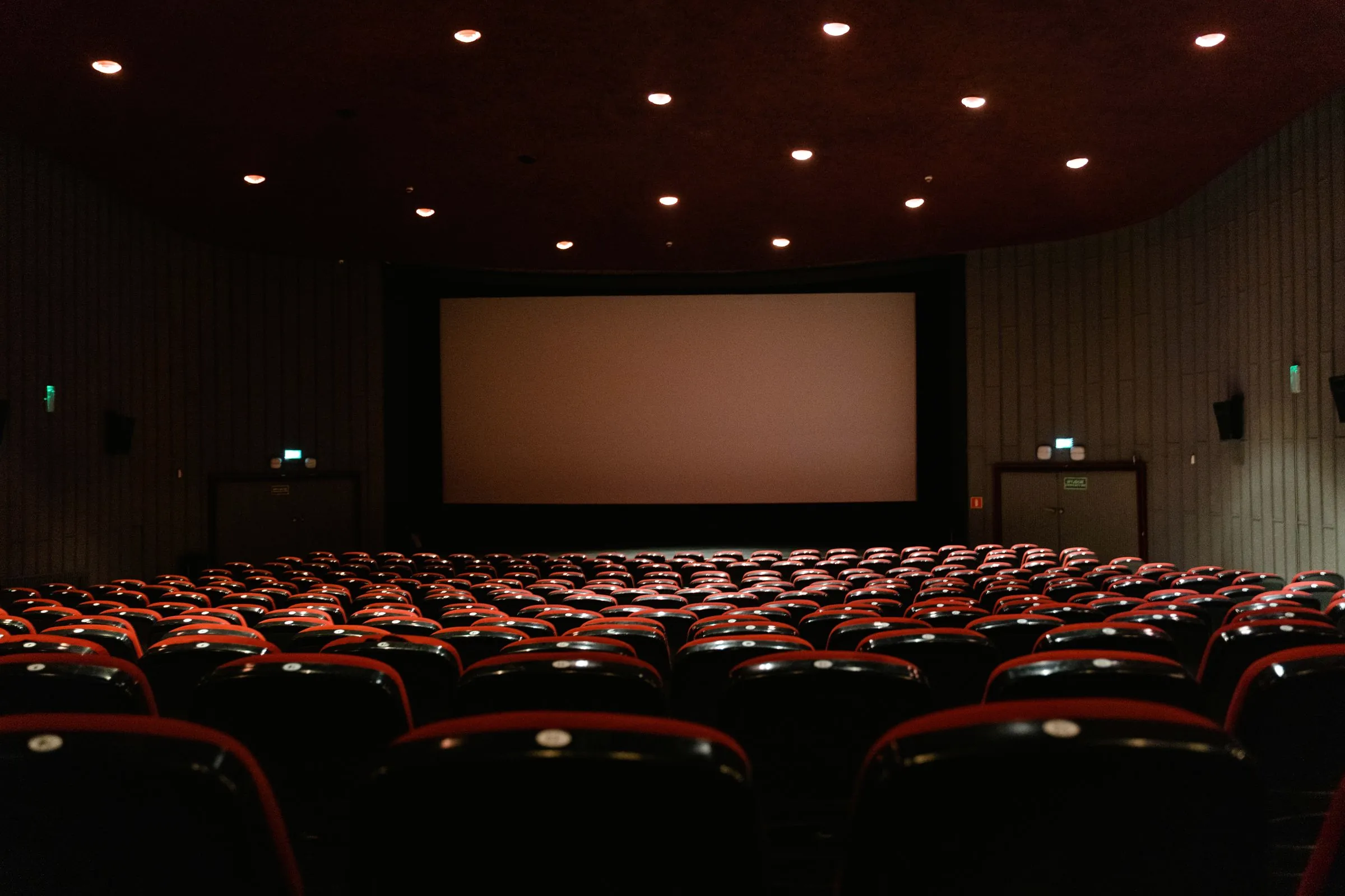 Rows of red seats facing the screen in the 1951 cinema where the South Hills location meets