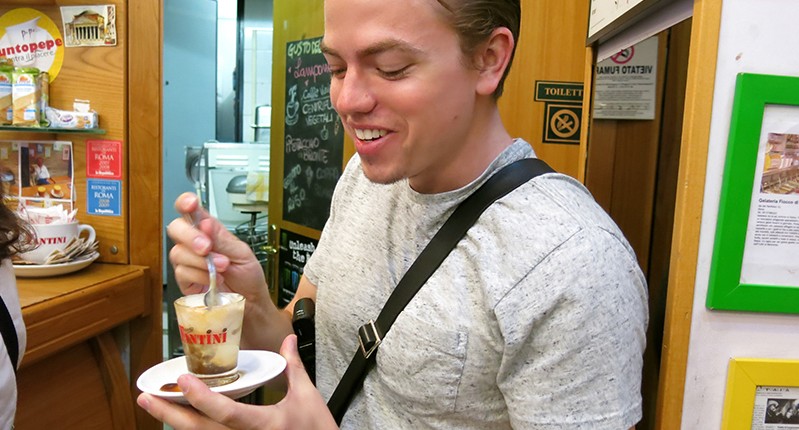 man holding coffee cup