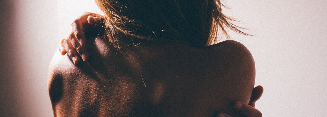 a woman showing her naked back