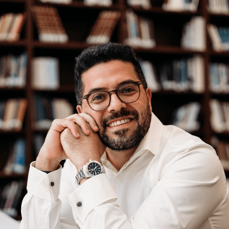 Profile portrait of a man in a grey shirt