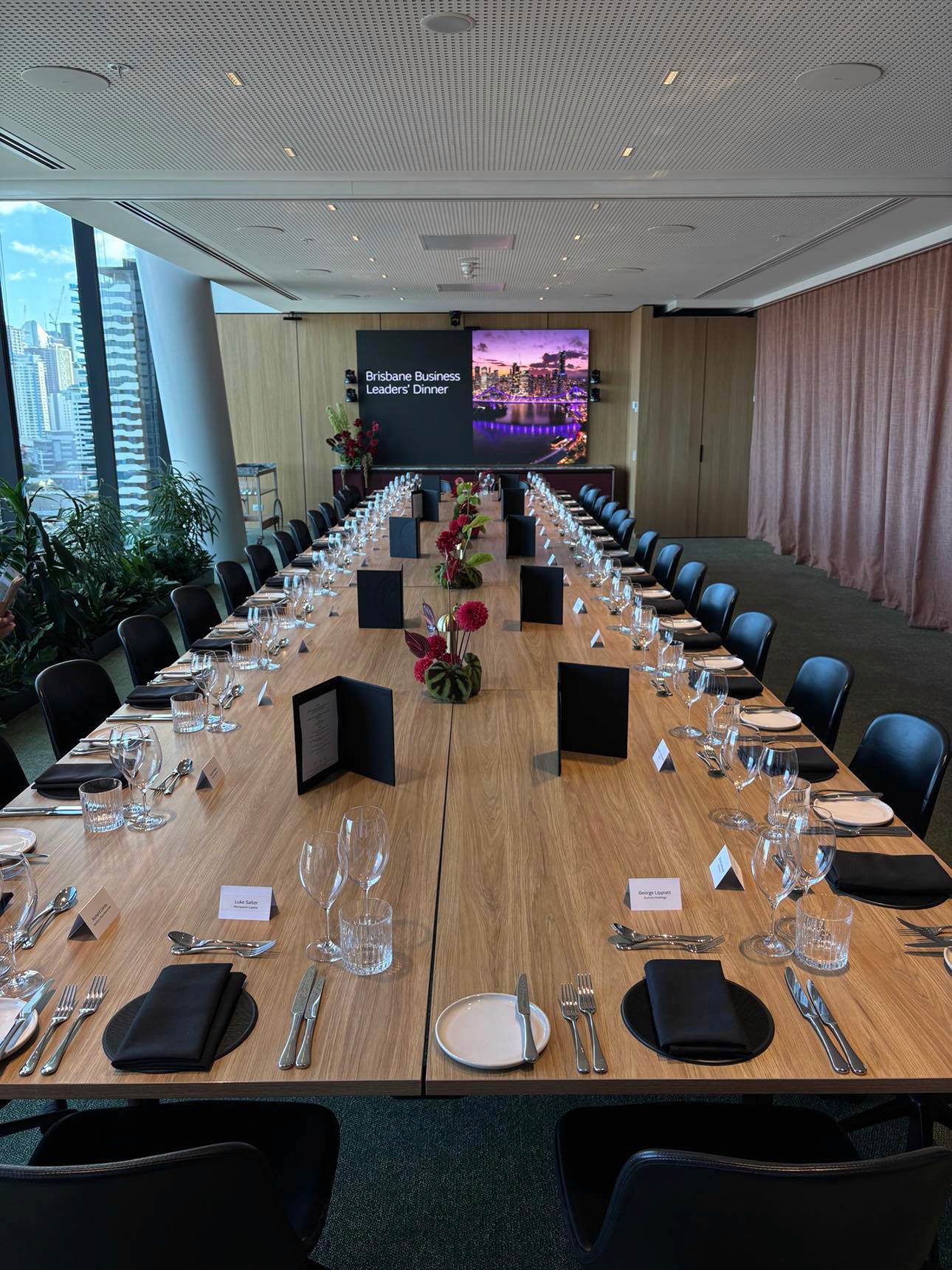 Boardroom meeting table in a Brisbane Corporate office set up for a sit-down meal