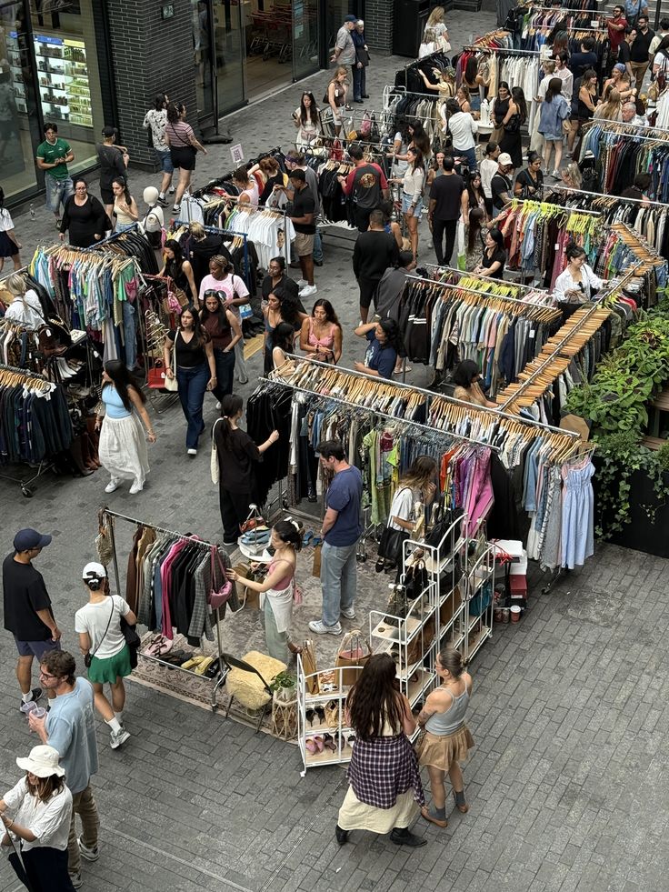a group of women standing on top of a sandy beach