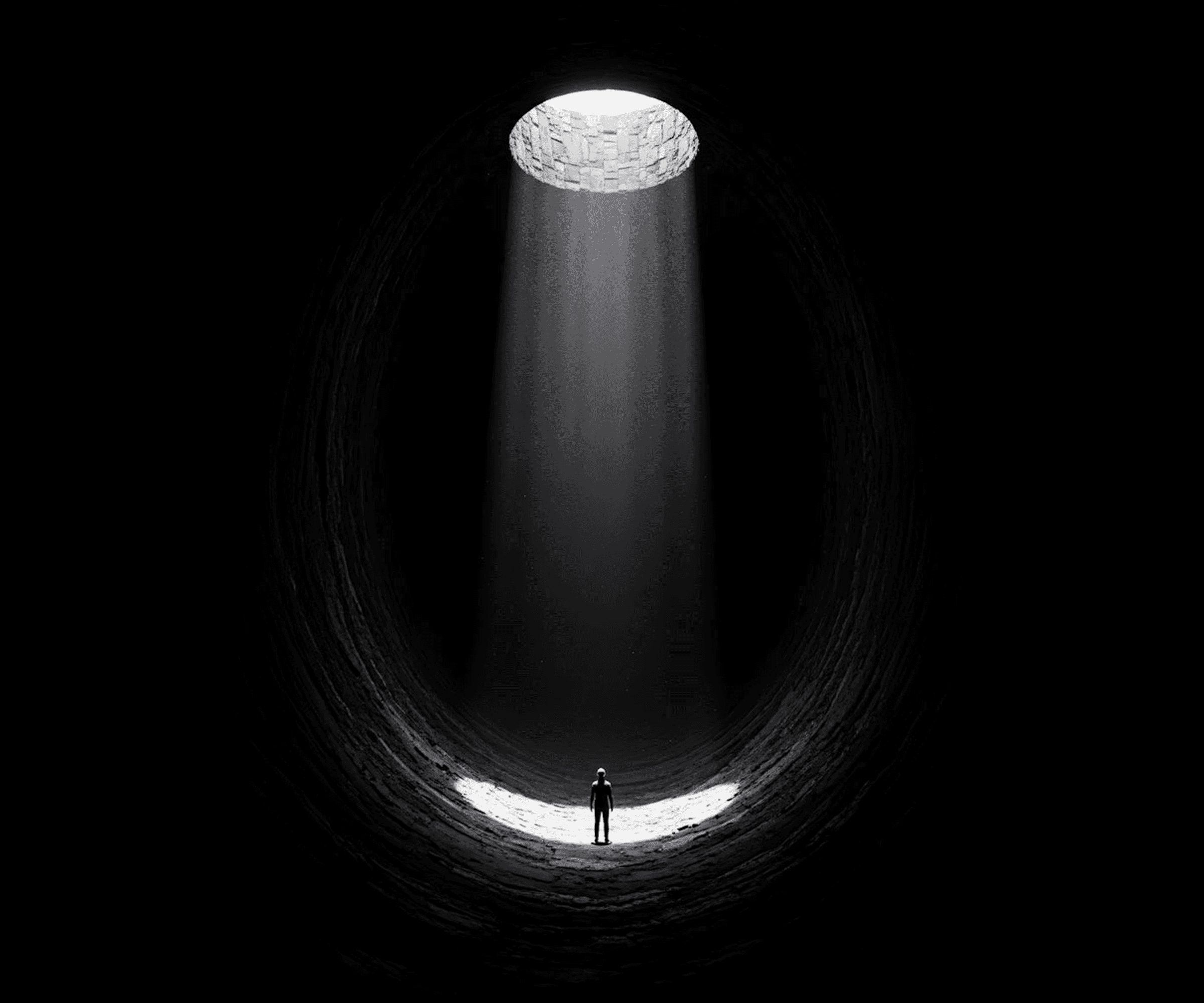 Lone figure standing inside dark tunnel with light from above — representing clarity found through deep product analysis before redesign