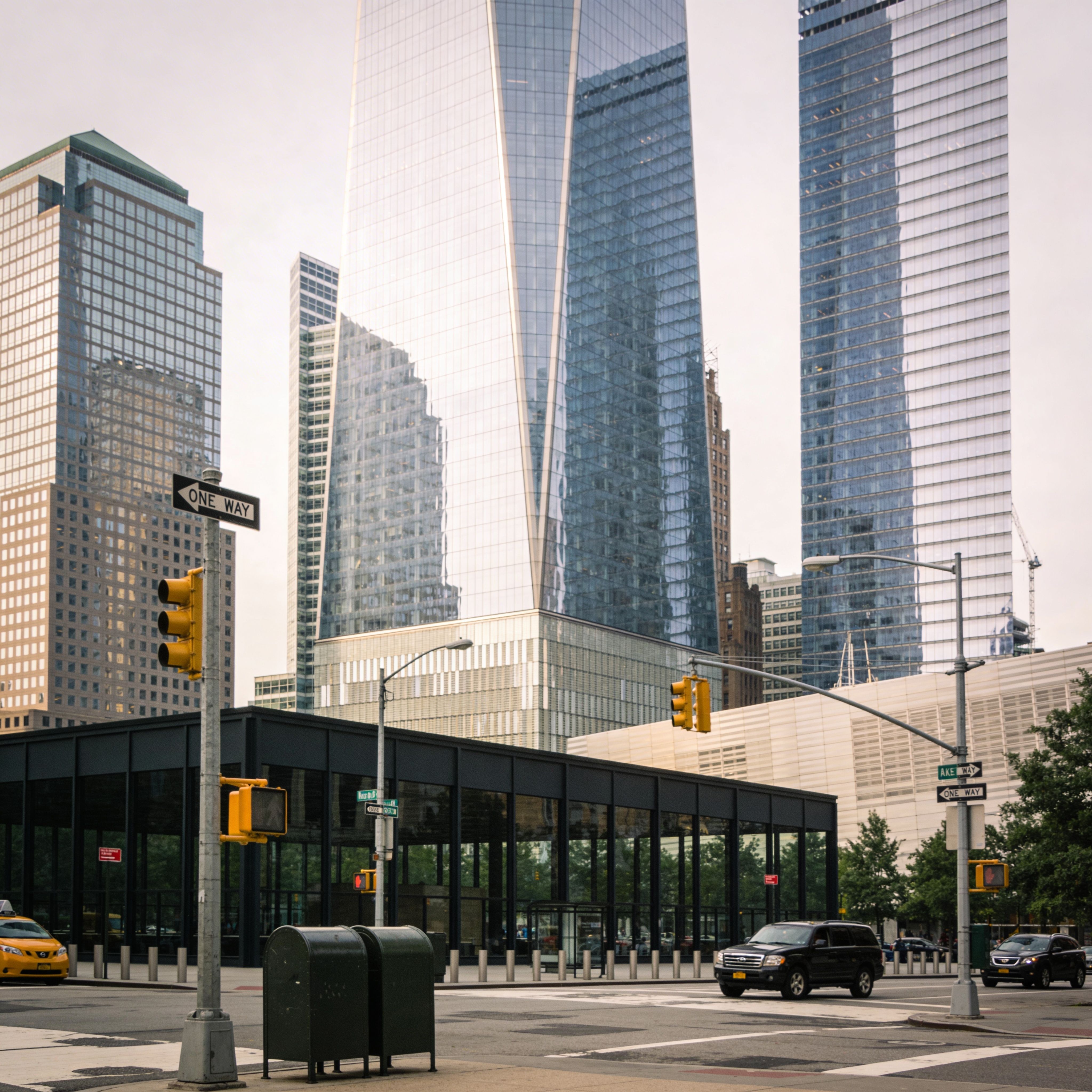 New York city street with modern skyscrapers, traffic lights, and urban intersection