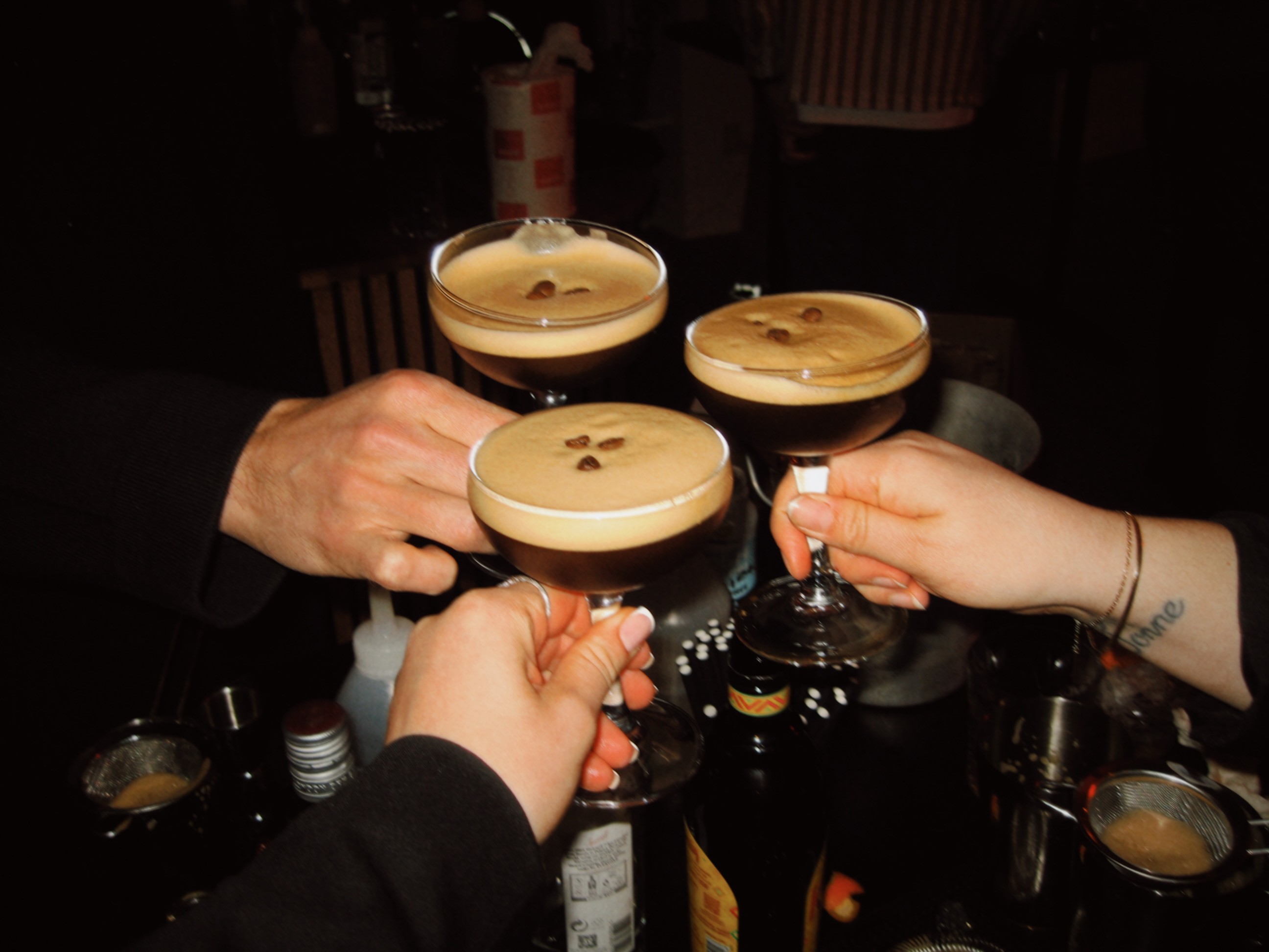 Cheersing espresso martinis with friends