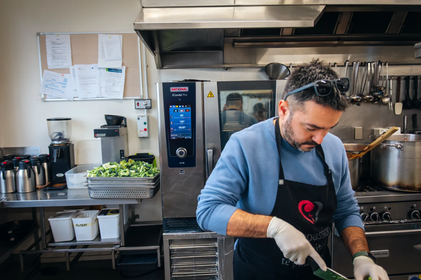 Soup kitchen worker preparing vegetables