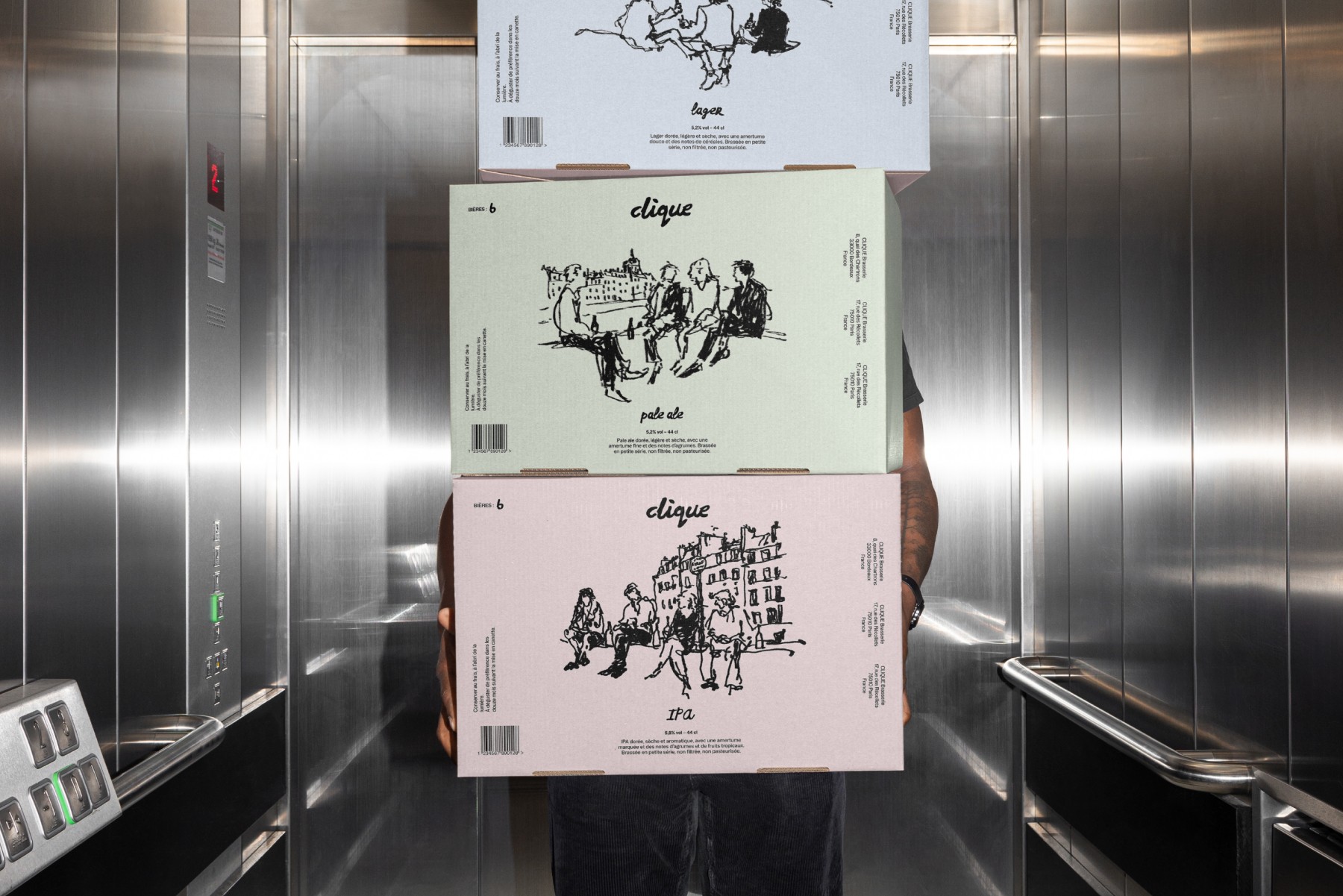 Cartes de visite minimalistes arcadie posées près d’un bois flotté, papeterie élégante pour studio de yoga et bien-être.