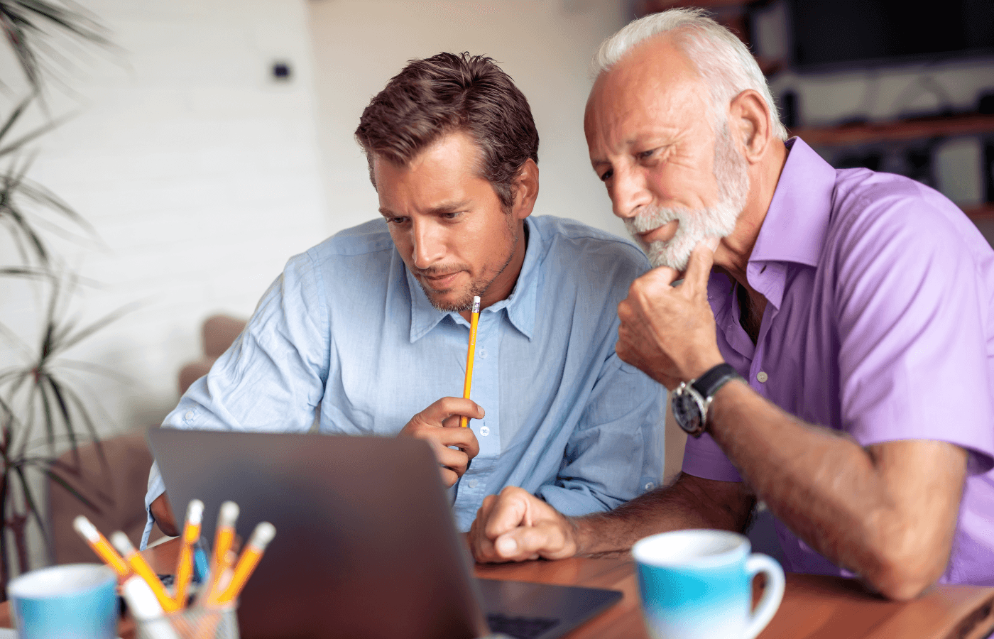 father and son working together on computer