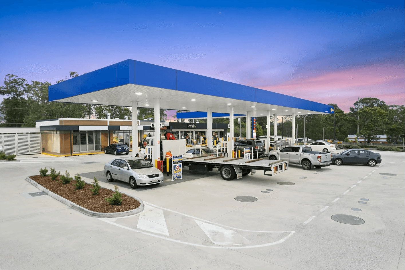 man wearing gray polo shirt beside dry-erase board
