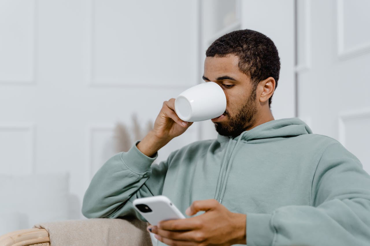 Person using a mobile app in an everyday setting, representing ongoing customer engagement