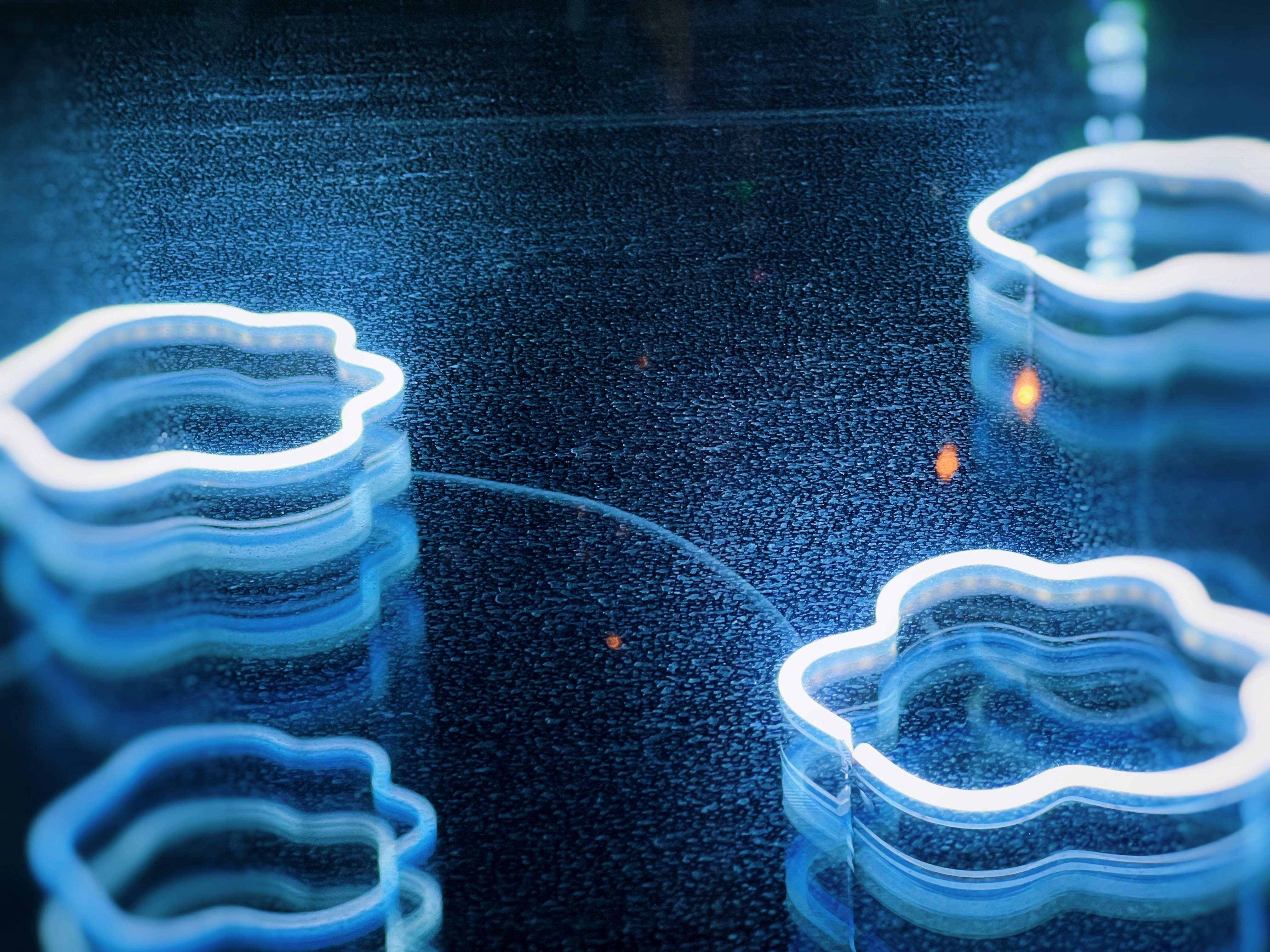 a group of plastic cups sitting on top of a table