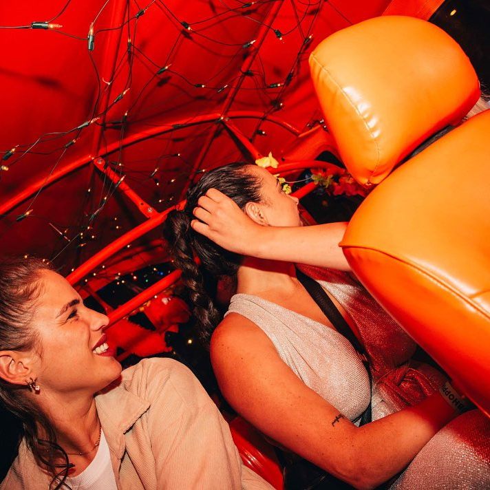 women in an orange car