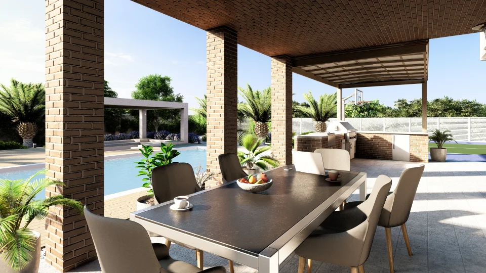 Modern outdoor patio alongside a pool, includes a dining setup, lounge area, and outdoor kitchen. Large tiles, brick structures and lush greenery create a resort-like ambiance.