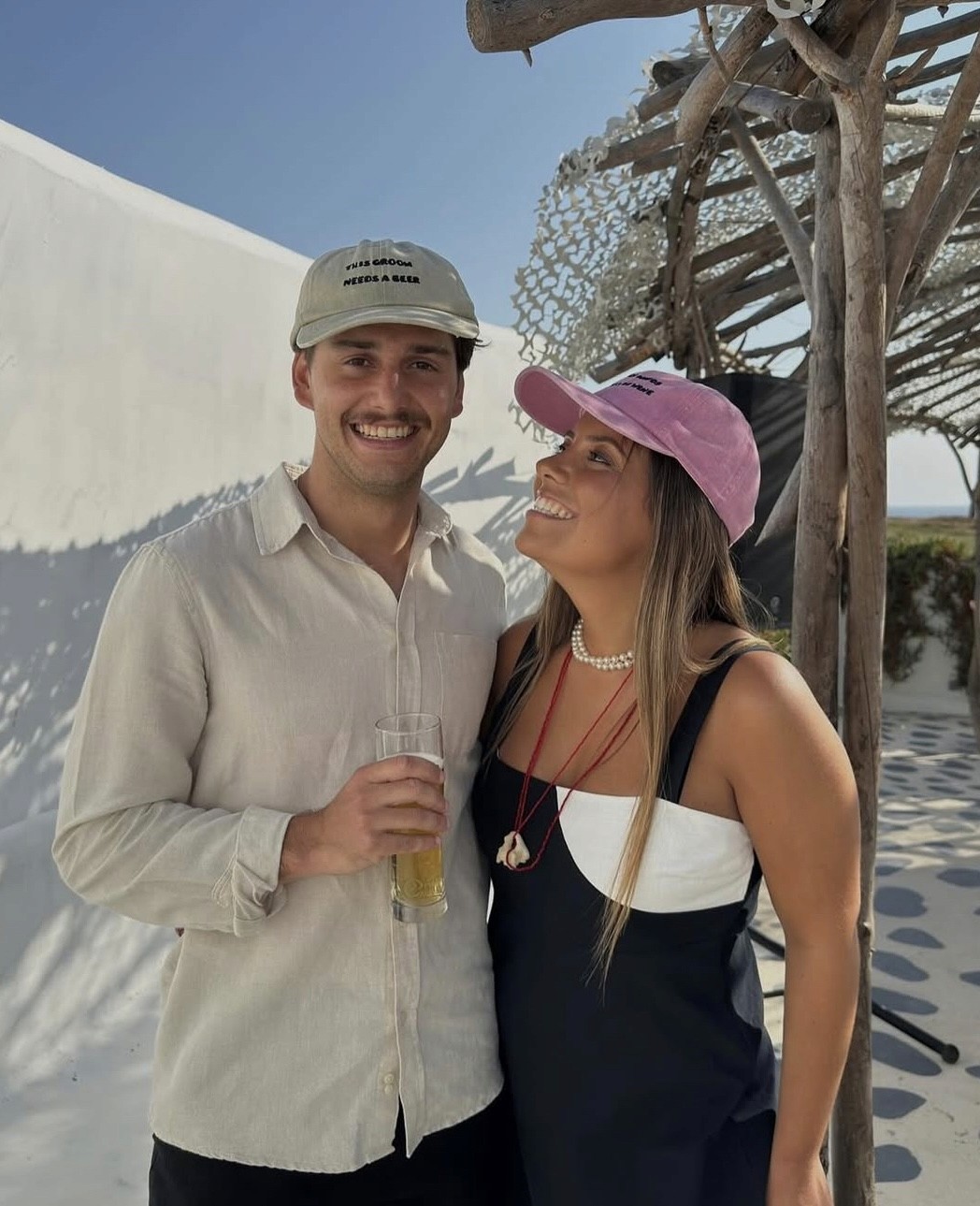 Couple portrait with dog on field