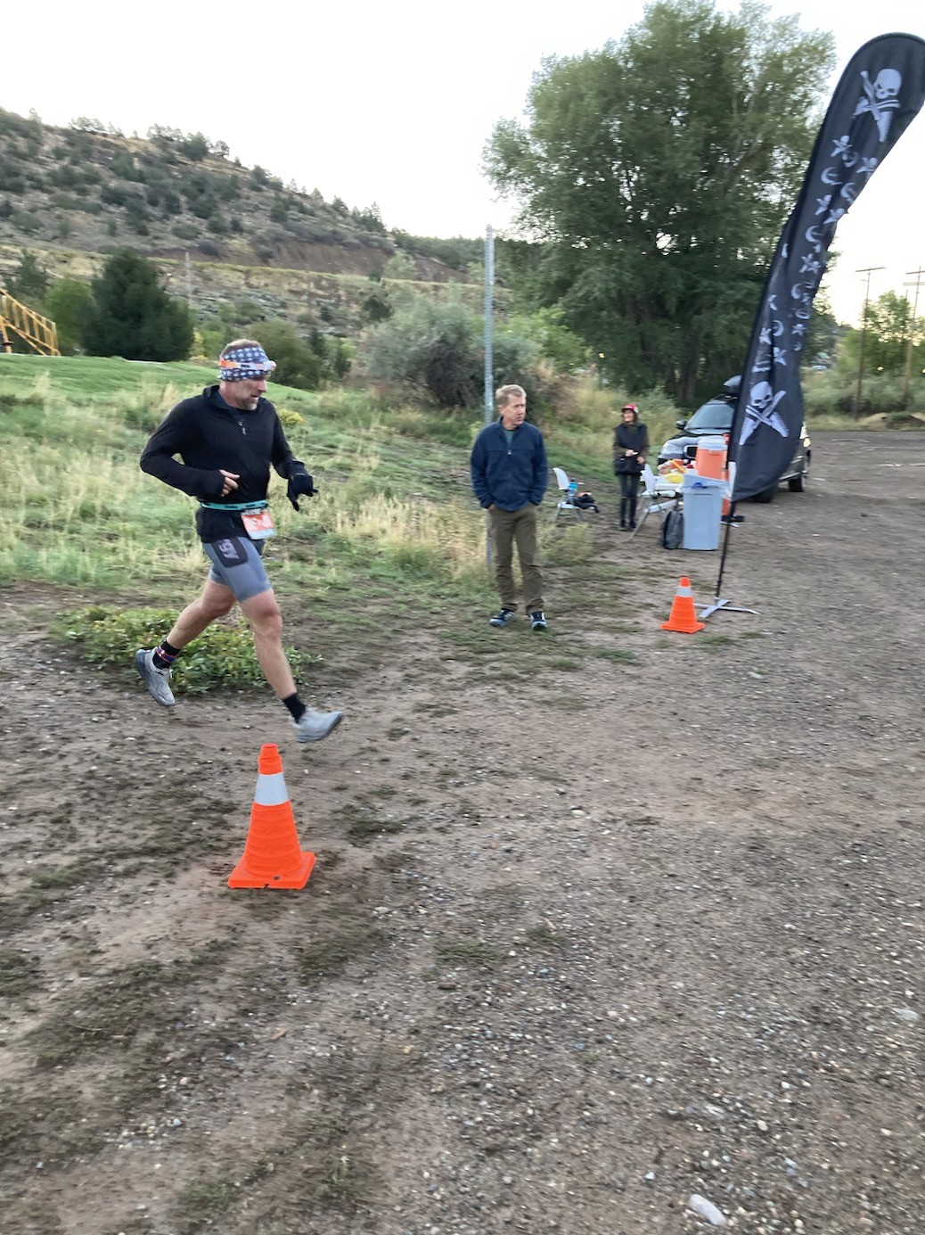 Trail runner on singletrack above the valley