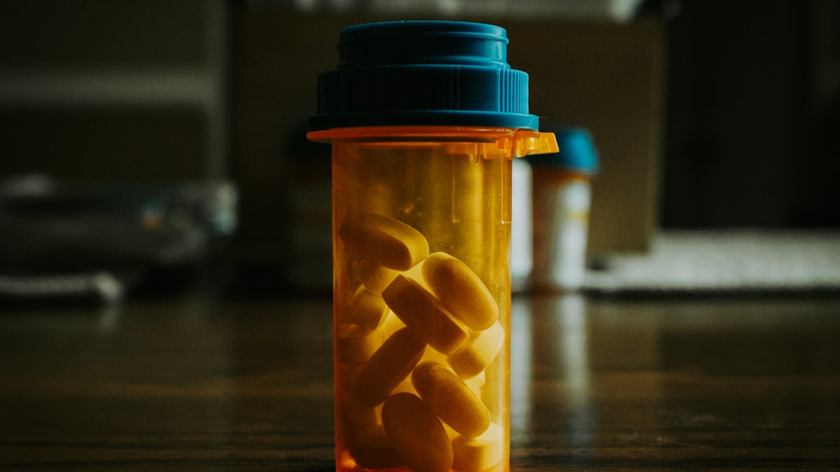 A grocery bag of prescription bottles, over-the-counter boxes, and supplements ready for a medication review in Hamilton, MT