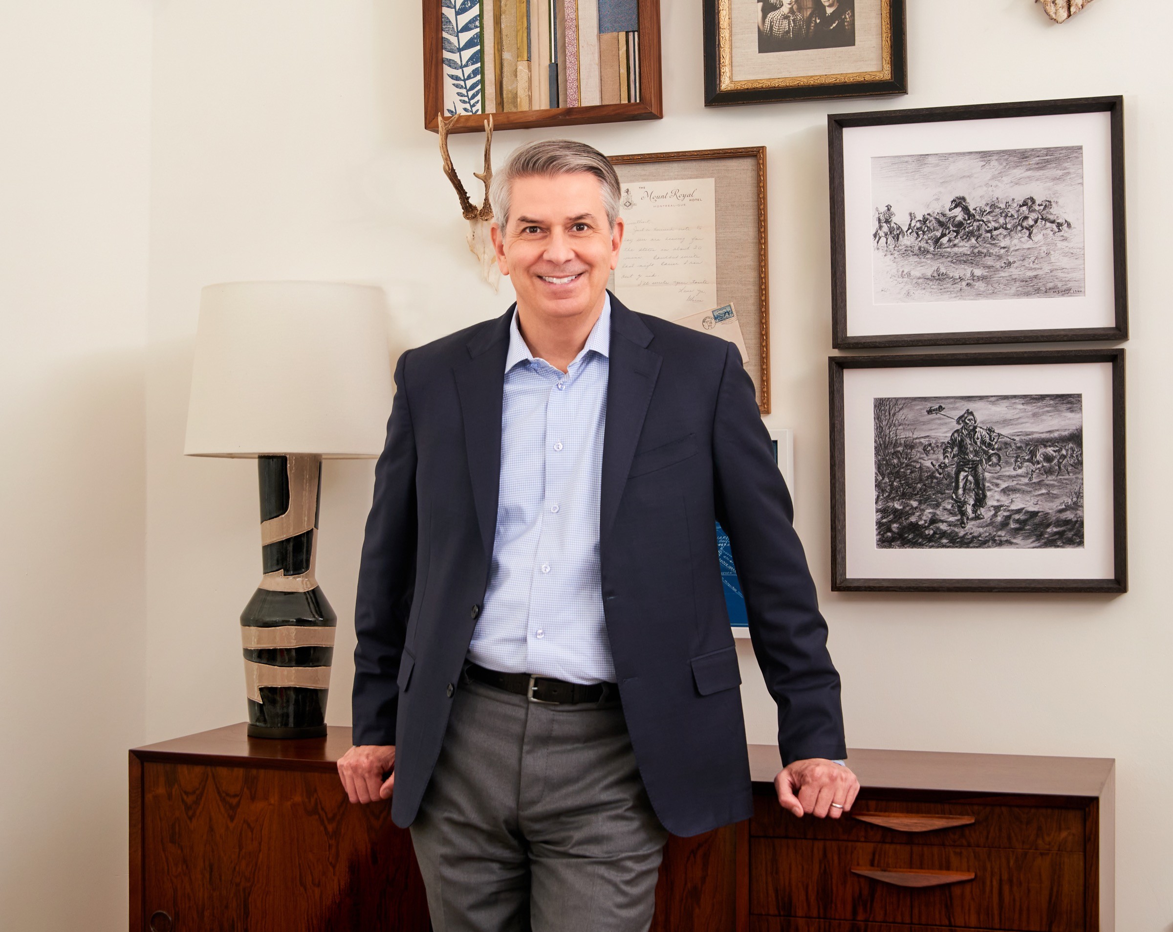 Executive portrait in a styled workplace environment