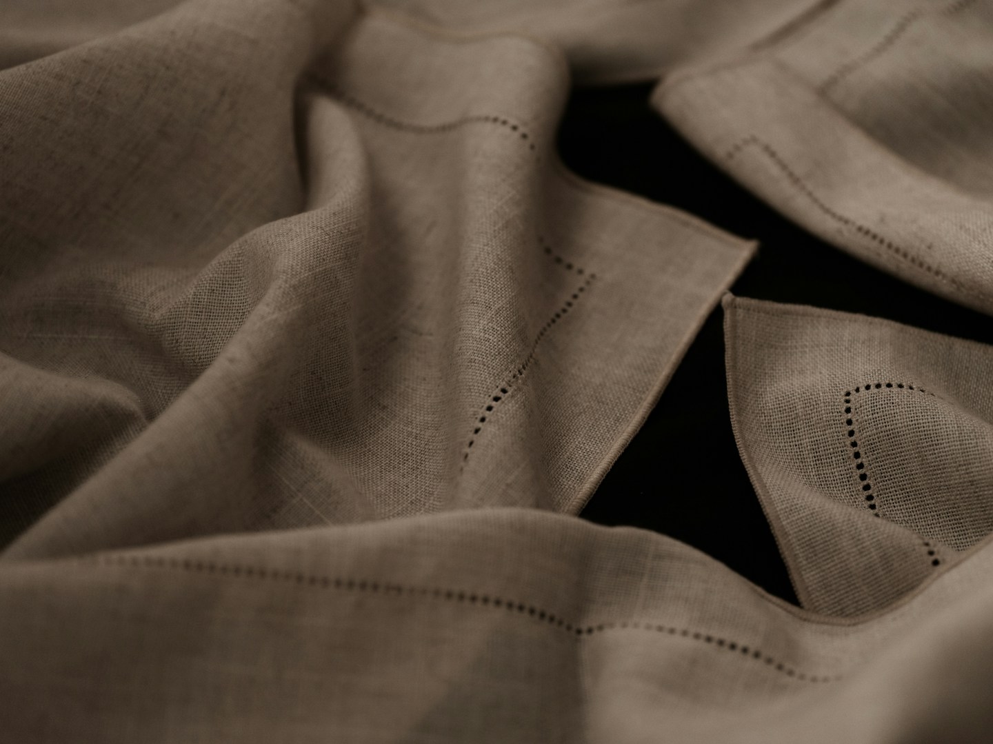 Drawn-thread work along a linen hem