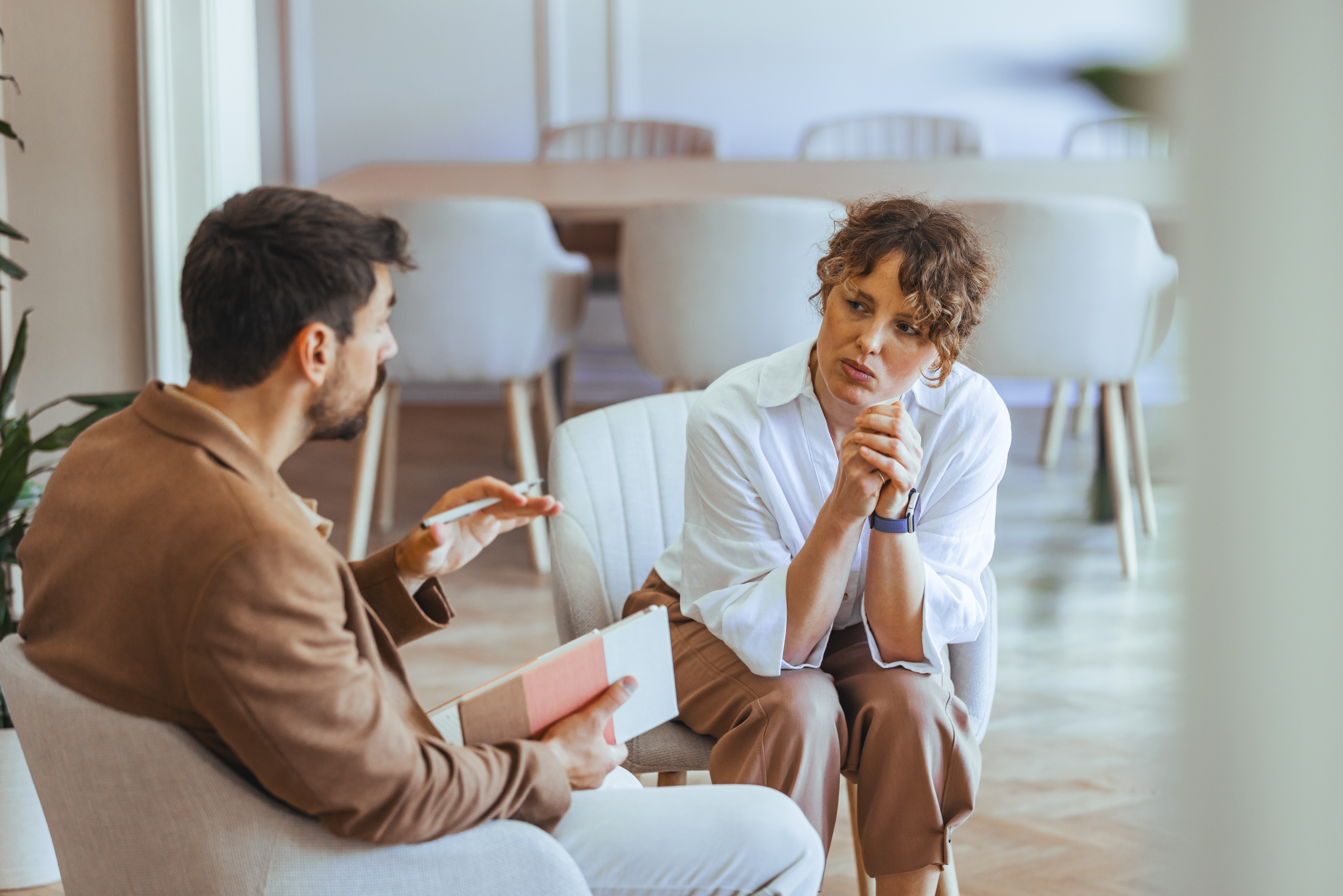 Two professionals in discussion reviewing second mortgage lending options
