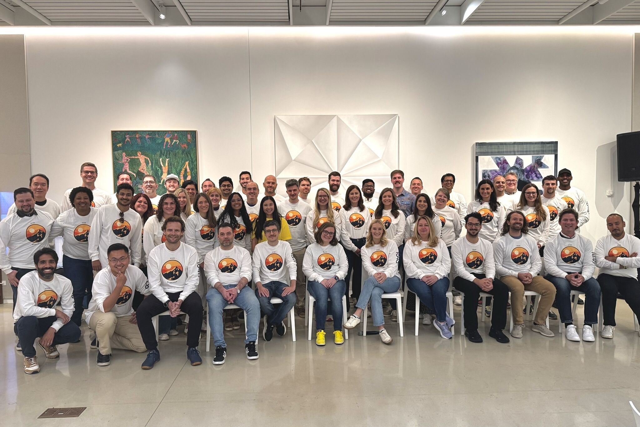 man in white dress shirt sitting beside woman in black long sleeve shirt