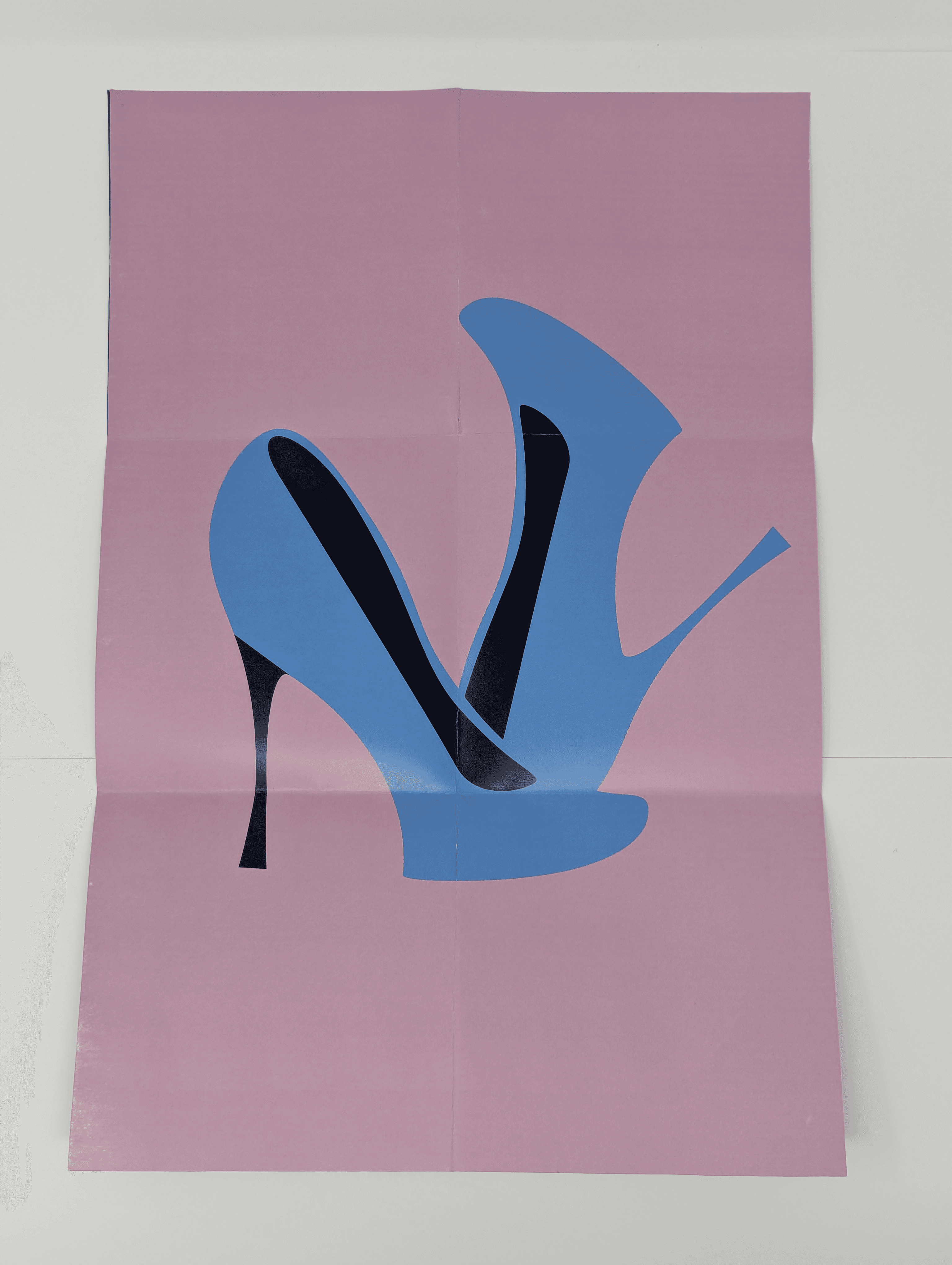 A poster size of high heels resembling the letter "n."