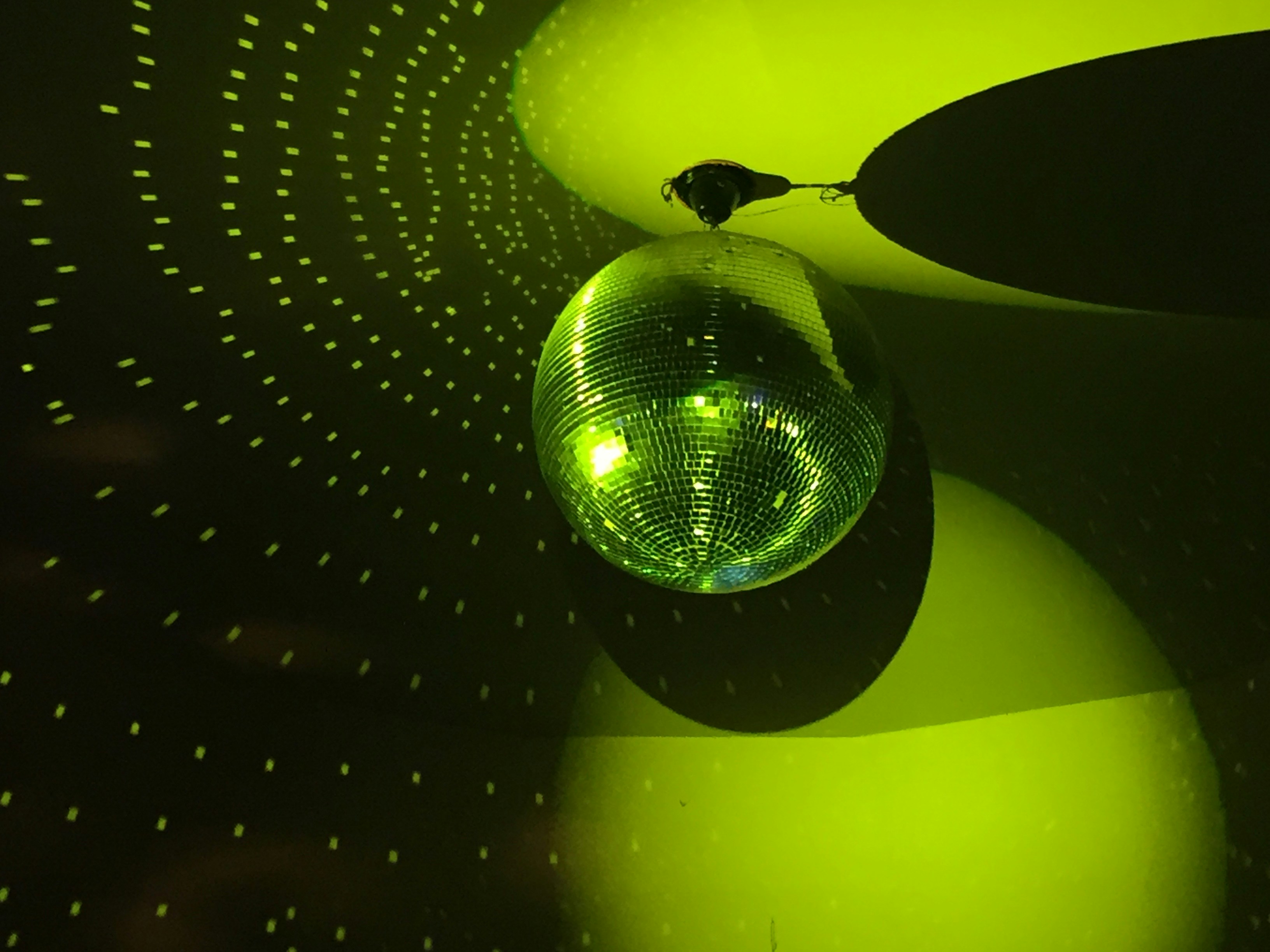 disco ball in green light