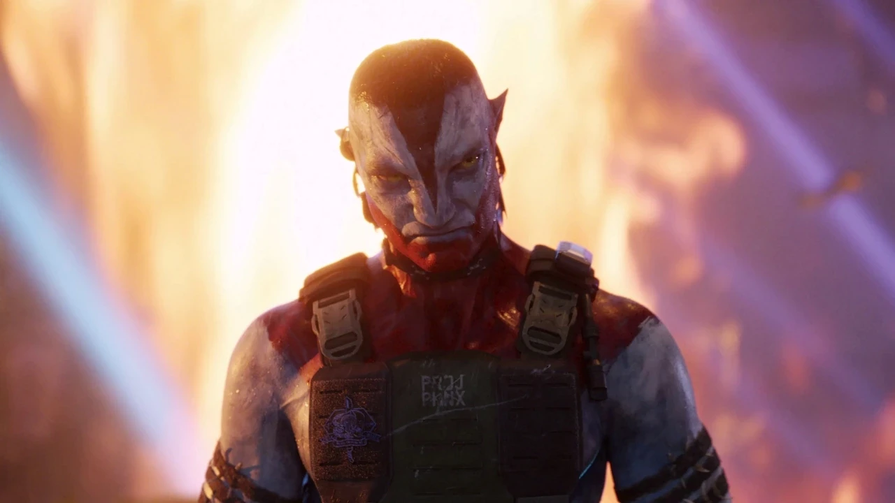 A blue-skinned, red-mouthed character wearing tactical gear stands confidently in front of a large, fiery explosion, creating a dramatic and intense scene.