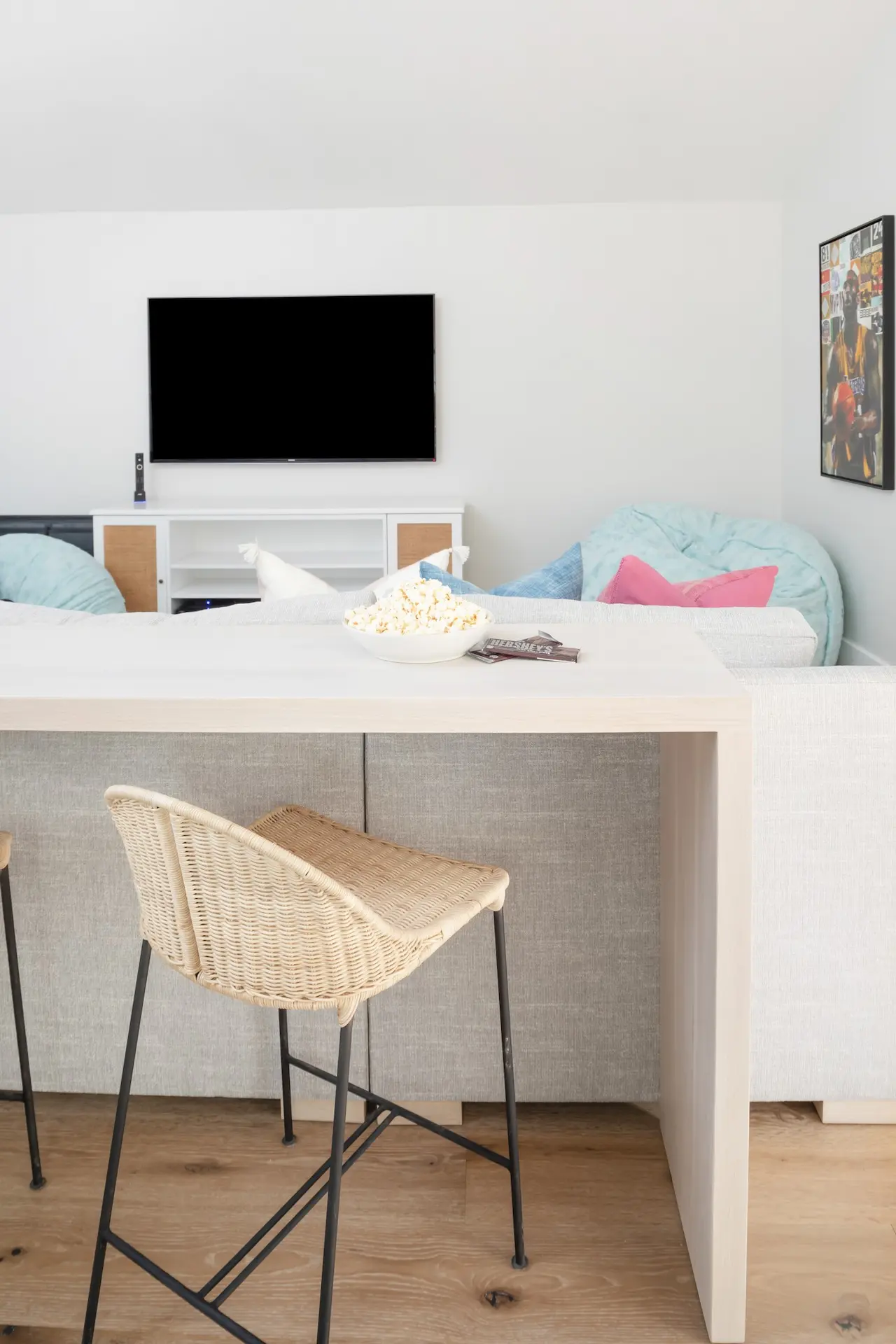 Sleek, minimalistic home office with woven chair in North Tustin Remodel & Addition. Photo by Molly