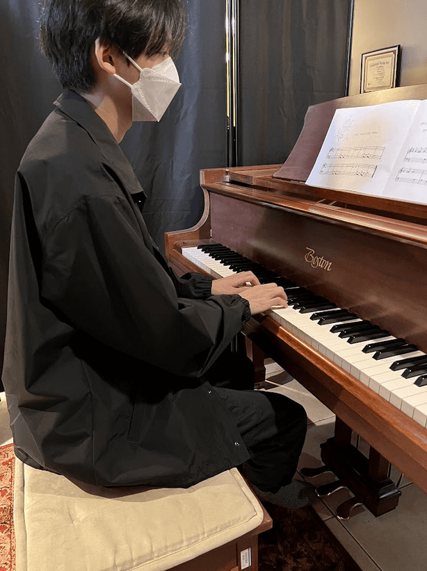 student learning piano