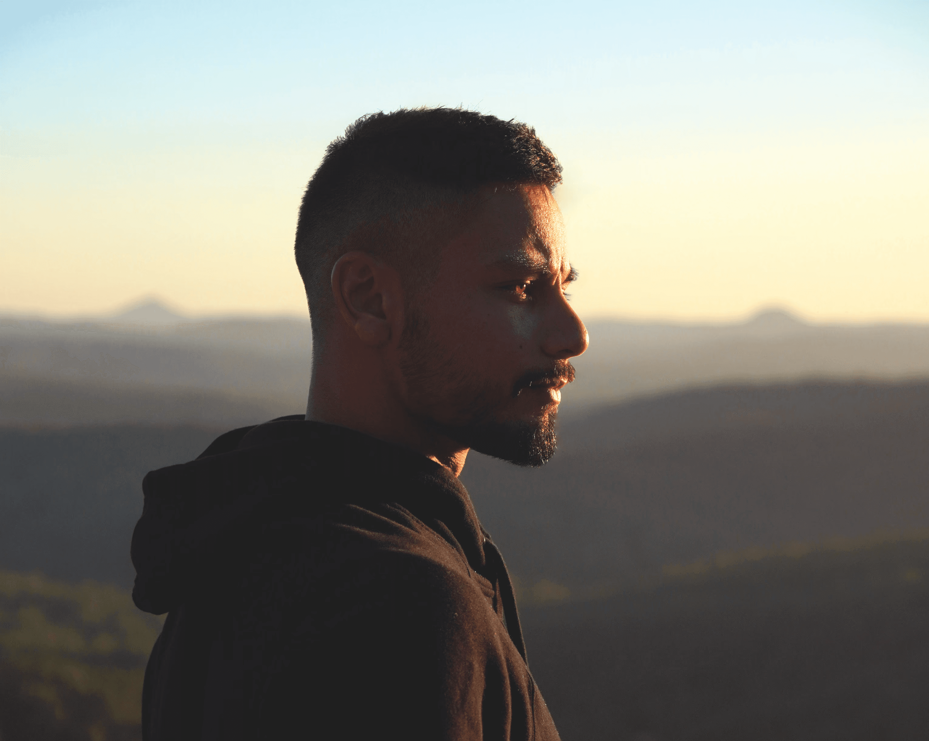 The image captures the ethereal beauty of an underwater cave illuminated by sunbeams penetrating through an opening above.