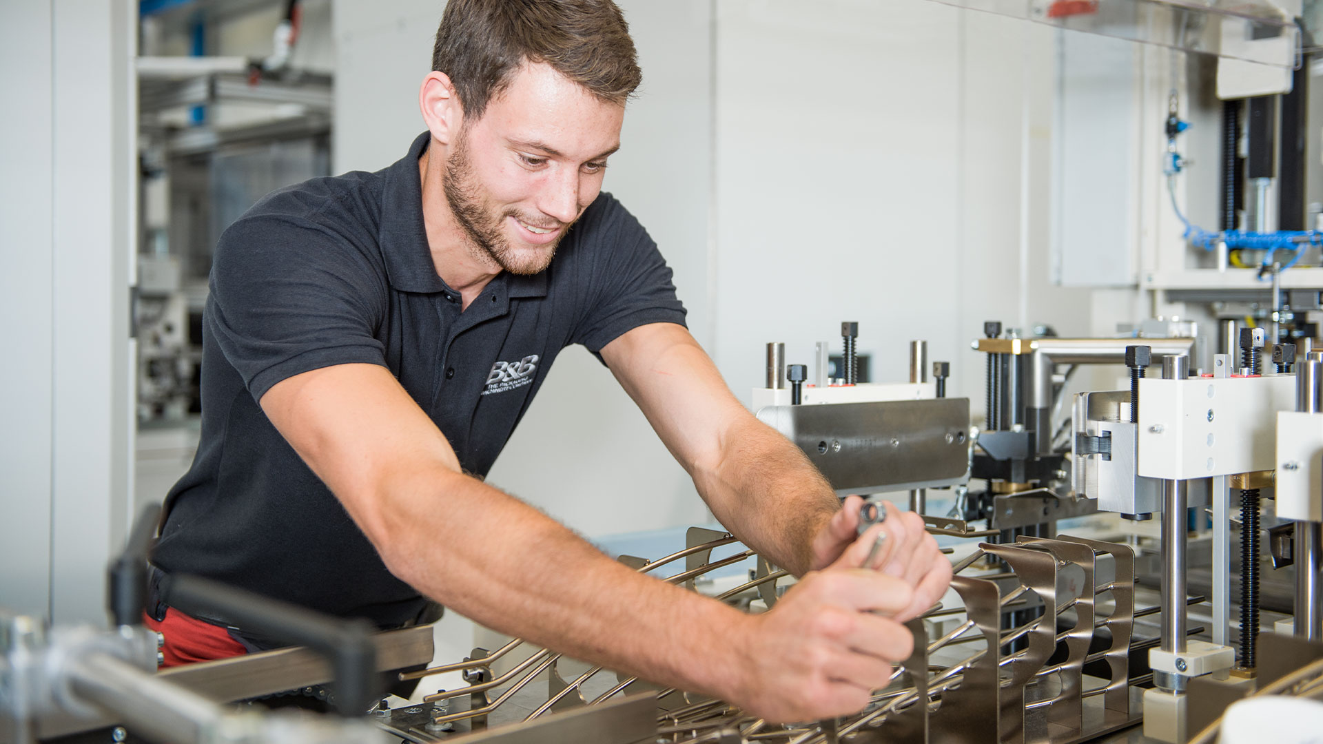 Technician at an industrial machine, working on equipment
