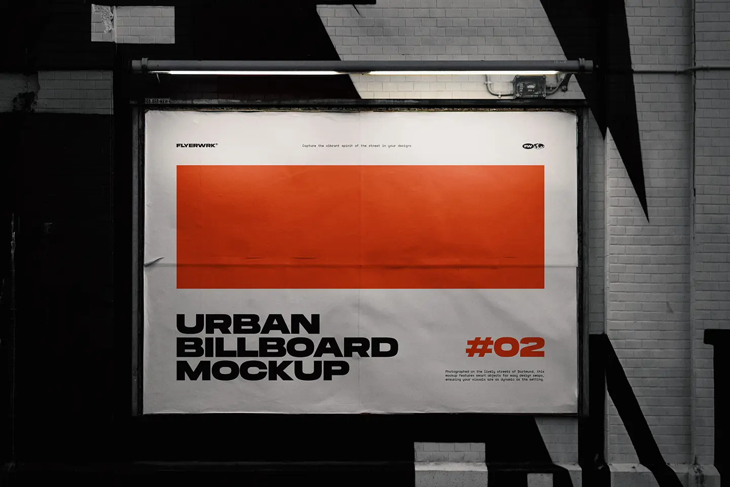 Urban billboard mockup on city wall under dramatic night lighting