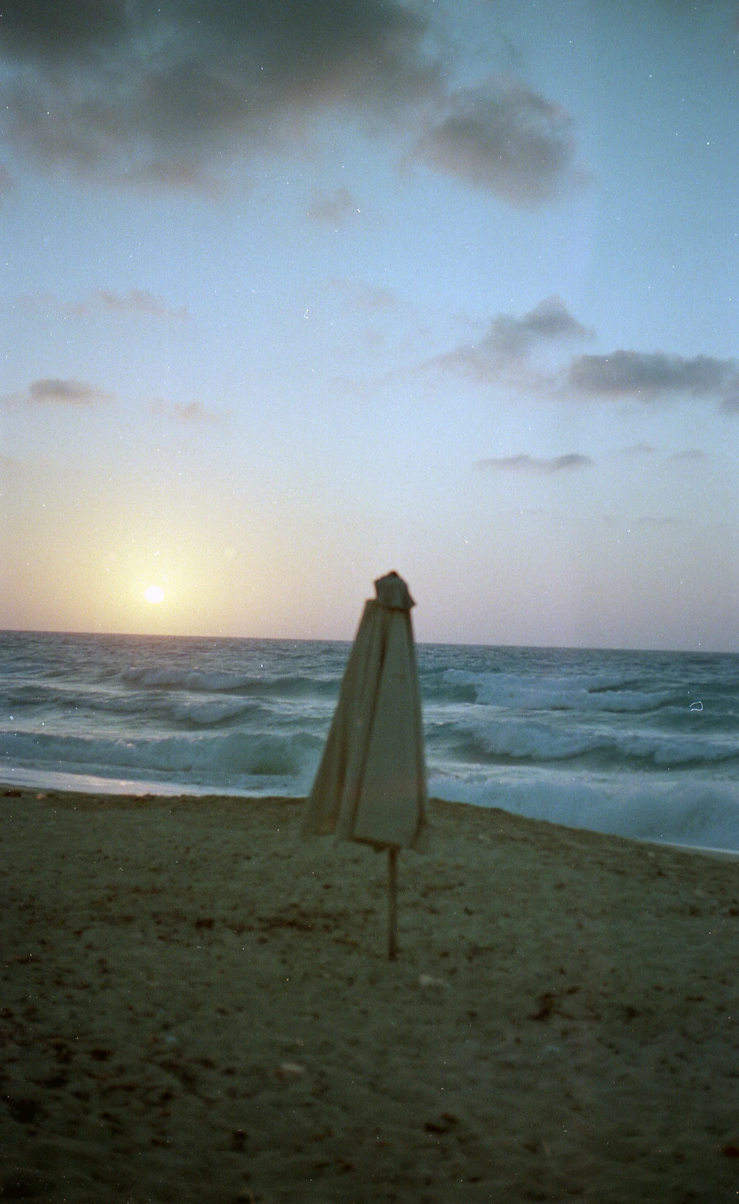 Closed Parasol at Sunset